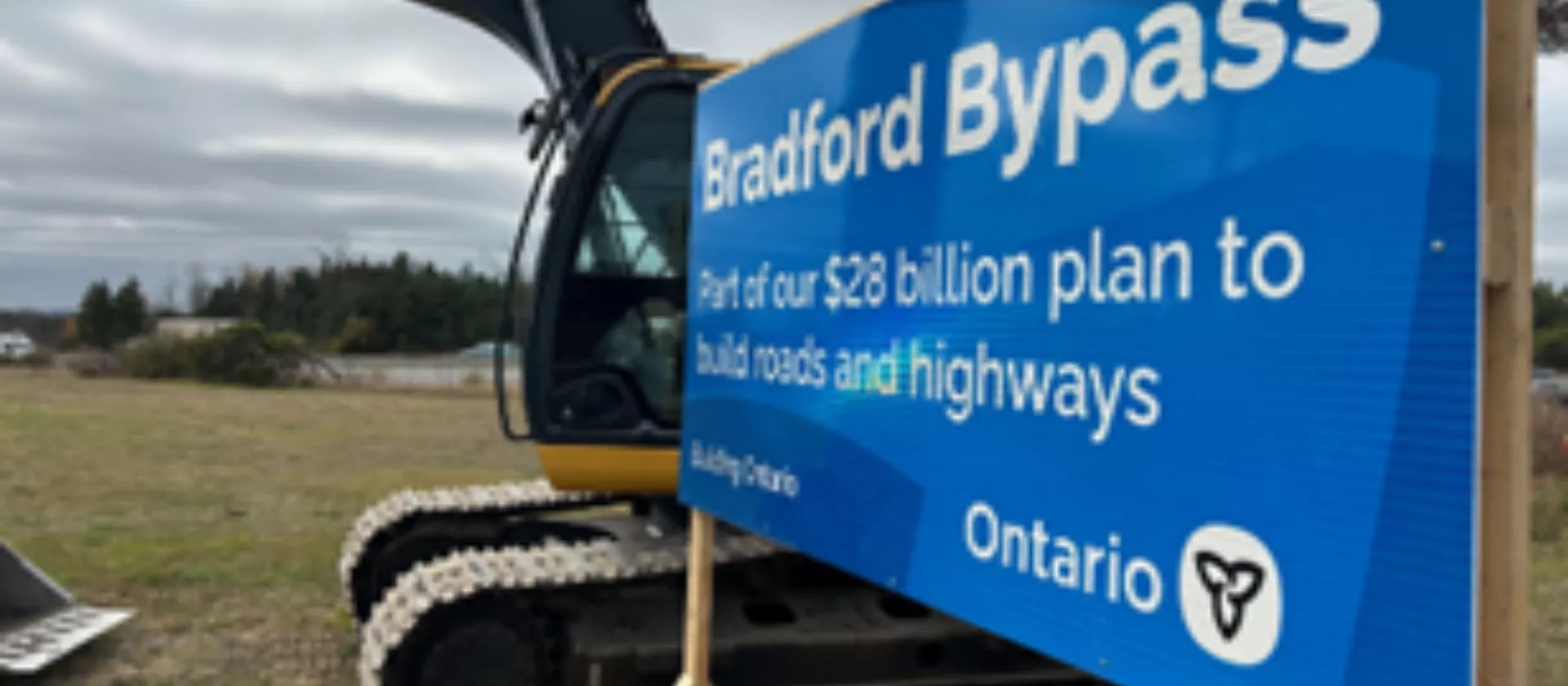 Ontario road sign promoting the launch of the Bradford Bypass project. 