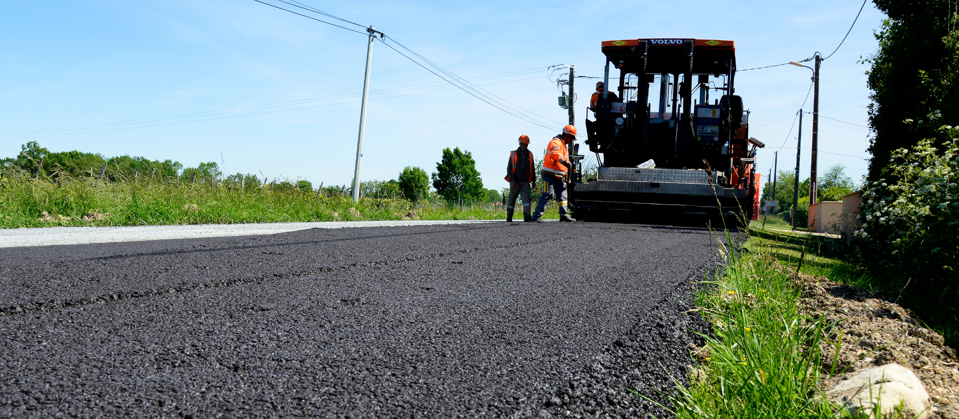 Colas crews pave the surface of a recently rehabilitated road. 