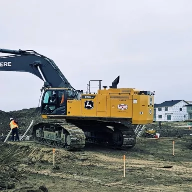 Standard General Calgary crew performs excavation work to prepare for paving.  