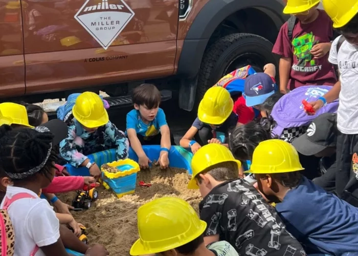 Children participate in The Miller Group's touch-a-truck event. 