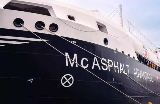 View of the bow of the McAsphalt Advantage with the name of the ship prominently displayed. 