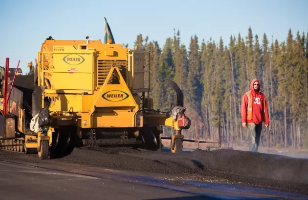 Crew completing paving work on the Highway 33 project
