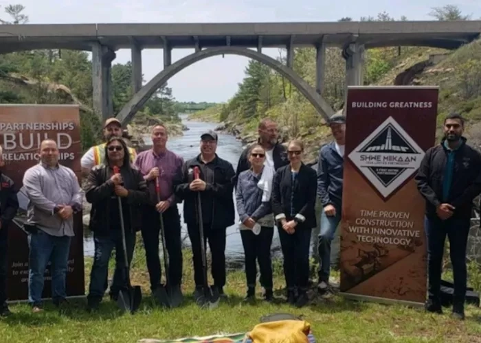 Representatives from The Miller Group stand with leaders from the Nipissing First Nation to celebrate the completion of the Magnetawan River Bridge Rehabilitation Project