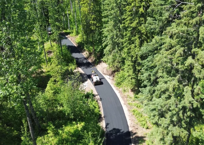 Colas company N.P.A. paves a walking trail in Northern Alberta. 