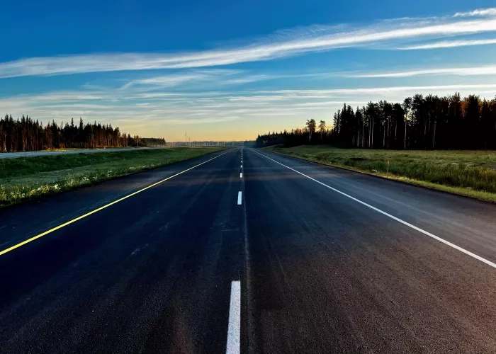 View of freshly paved asphalt along Highway 40