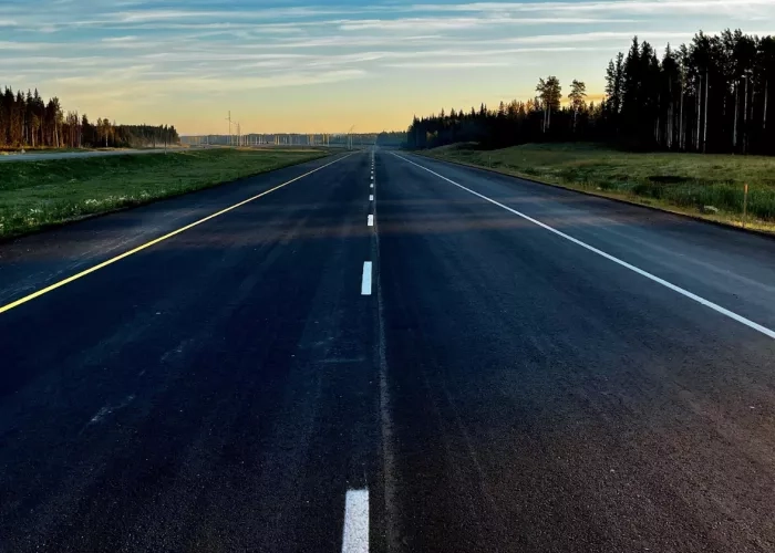 View of freshly paved asphalt along Highway 40