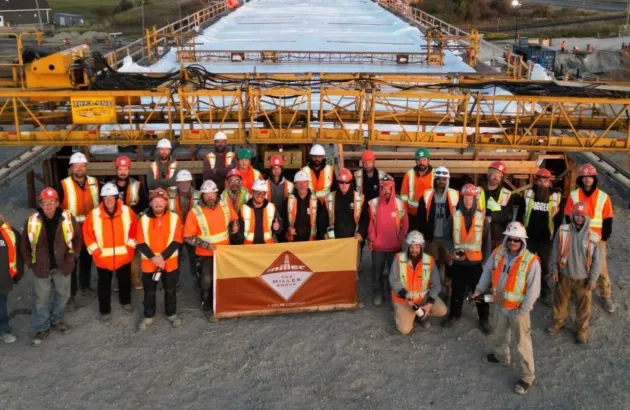 The Miller Northern team stands in front of the road deck of the Earlton Bridge