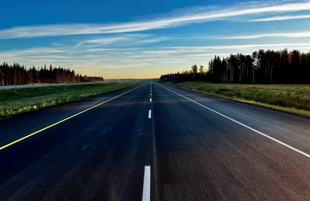 View of freshly paved asphalt along Highway 40