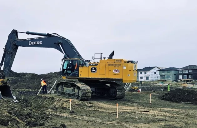 Standard General Calgary crew performs excavation work to prepare for paving.  