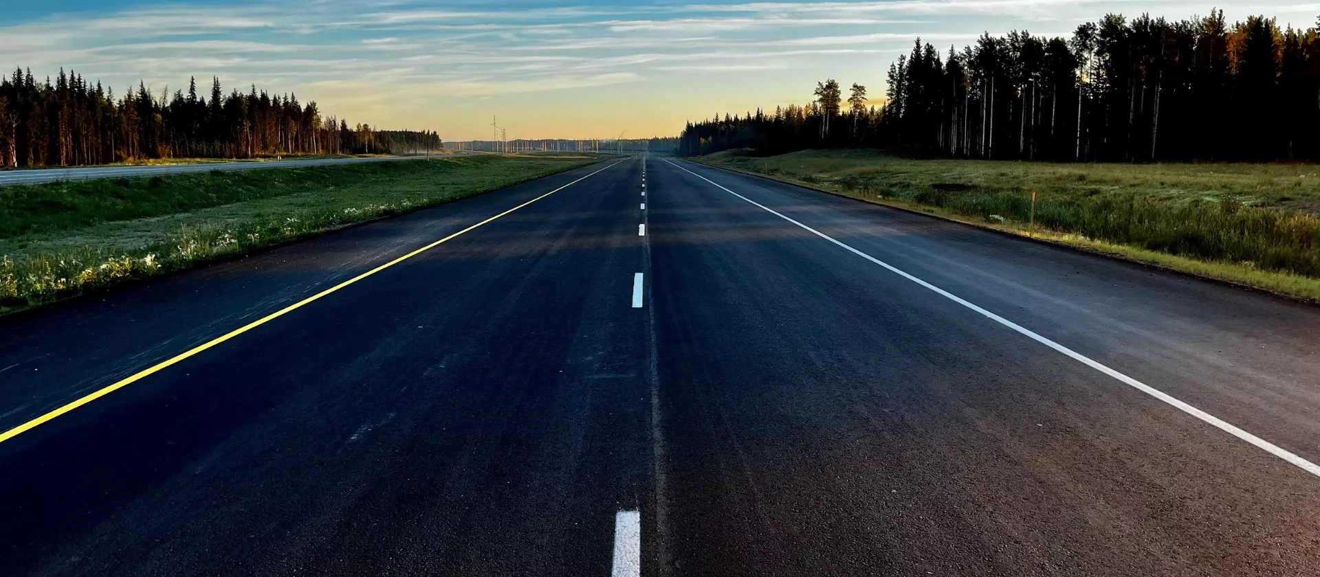 View of freshly paved asphalt along Highway 40